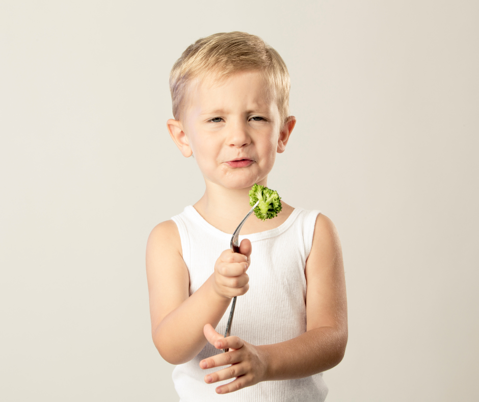 A young child refusing to each vegies - a fussy eater